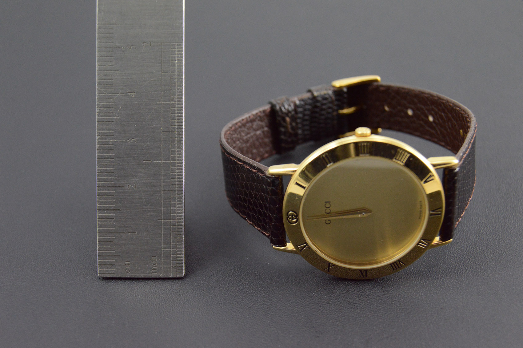 Gucci Gold Plated Round Roman Numeral Black Leather 25.5mm Face Vintage