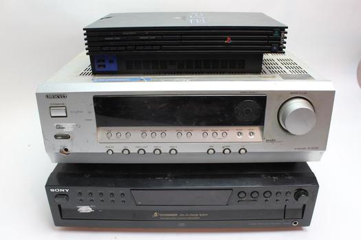 PlayStation 2 game console with multiple game cartridges