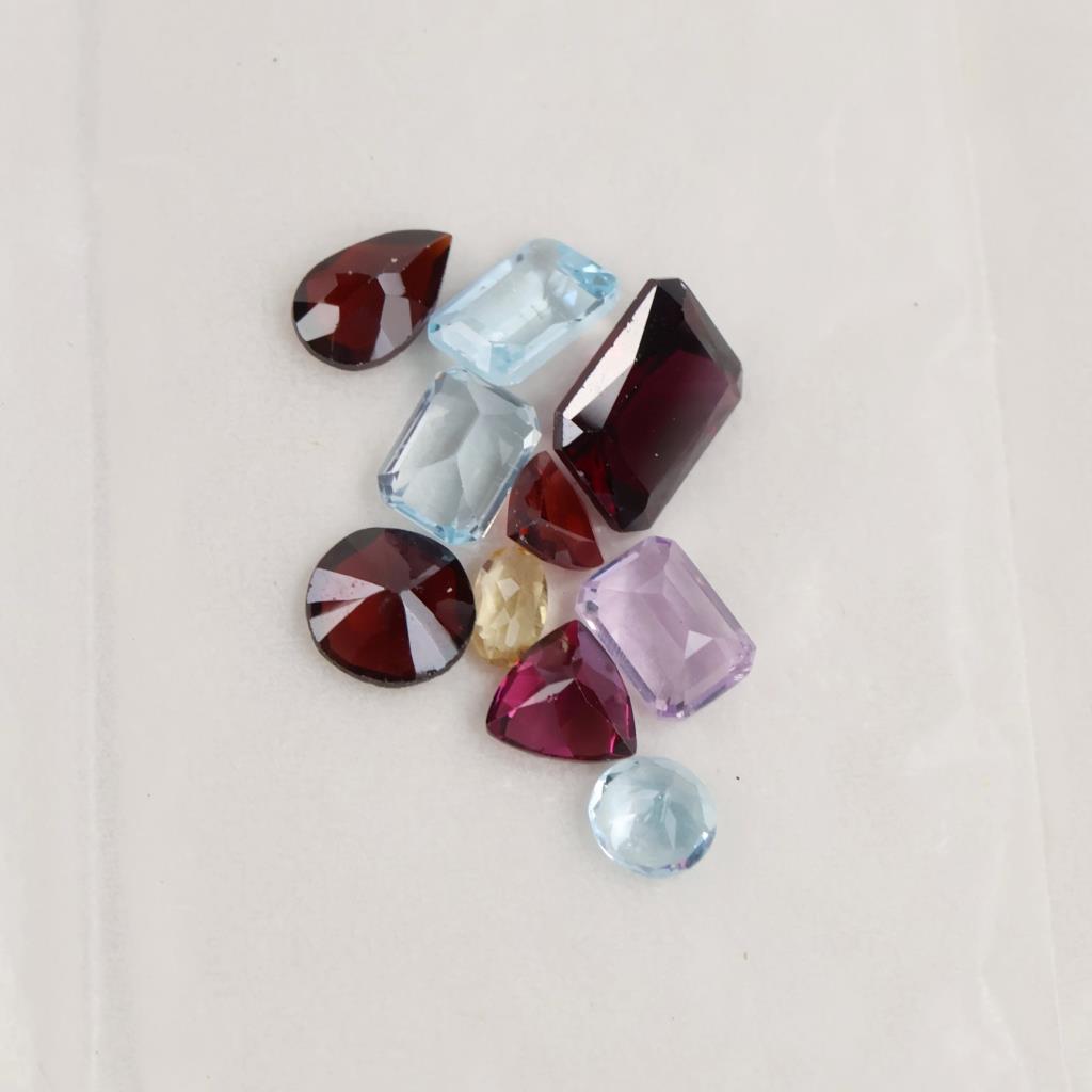 10 Loose Gemstones Including Amethyst, Garnet, Blue Topaz