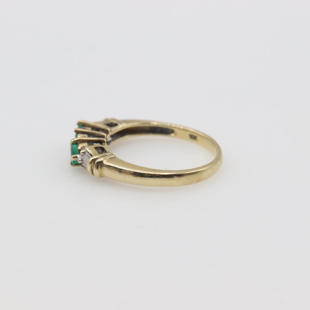 Gold double ring with dark green stone main image 0
