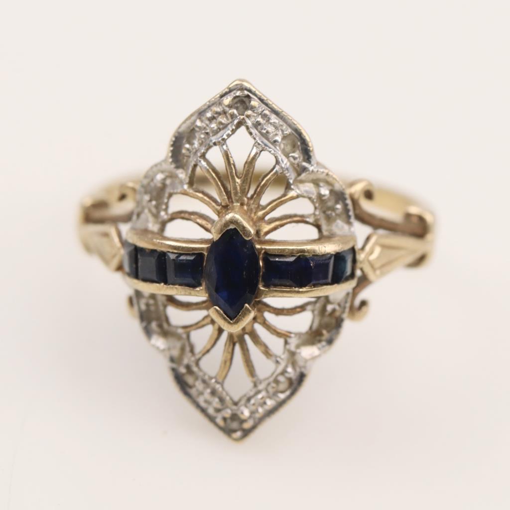 Gold double ring with light blue stone