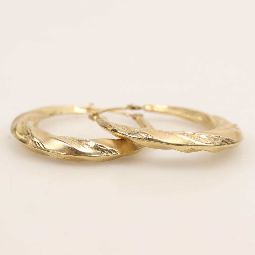 thumbnail interactive-video image 1 of 14k Italian Two-Tone Gold Love Screw Design Hollow Hoop Earrings (1.4 Inch, Hinged) 1 of 3