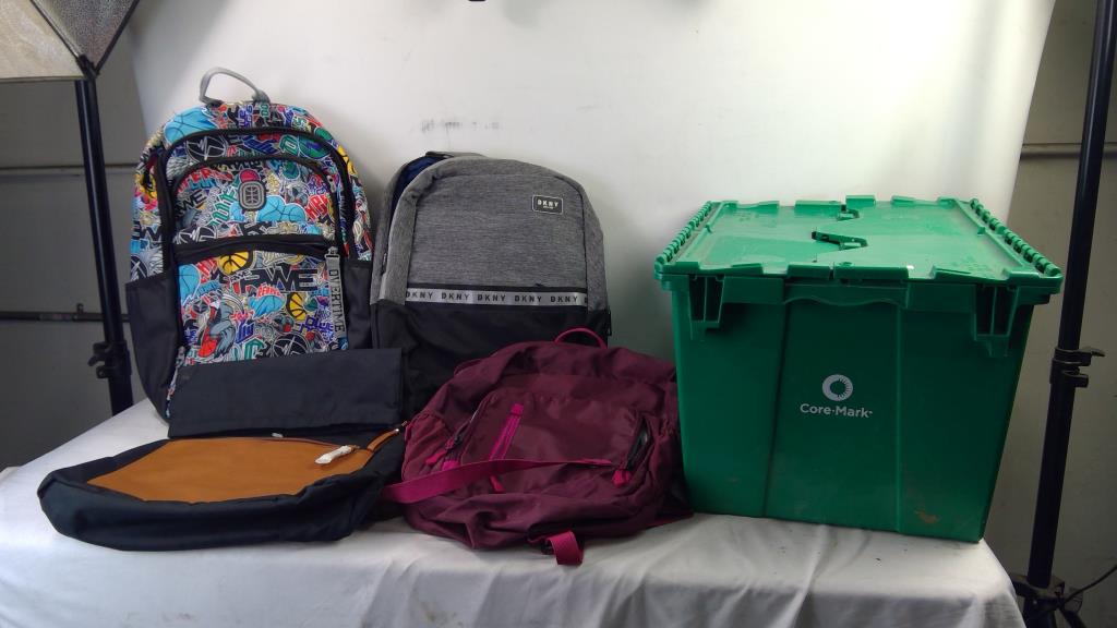 4 Backpacks In Green Container