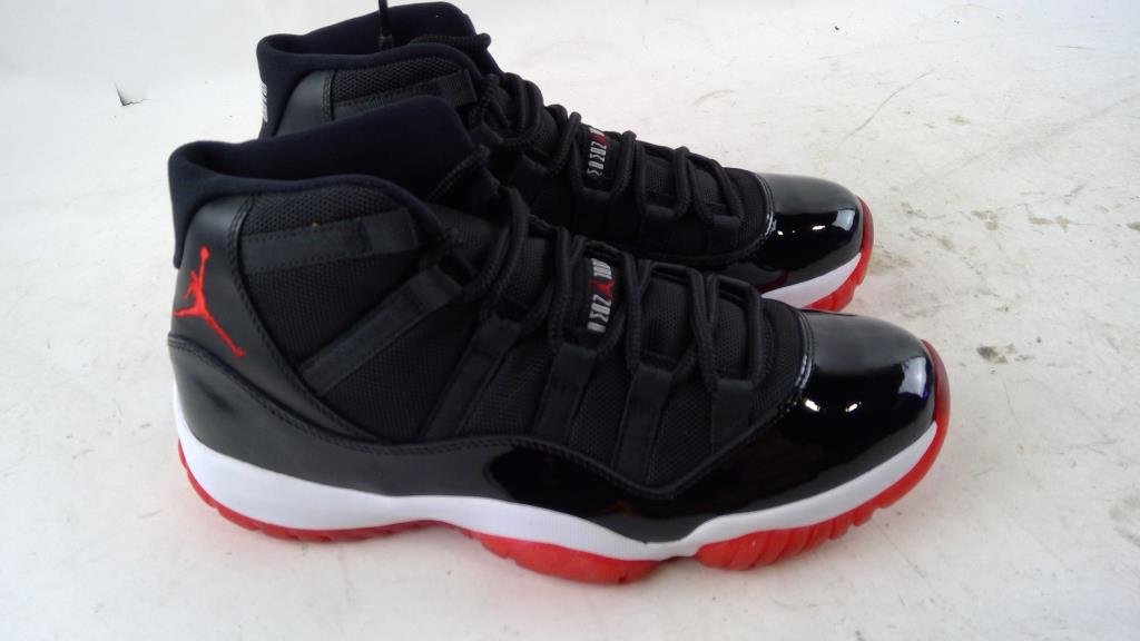 Red and black Air Jordan 11 Retro Mens Shoes Size 9 on auction in Ronkonkoma, NY