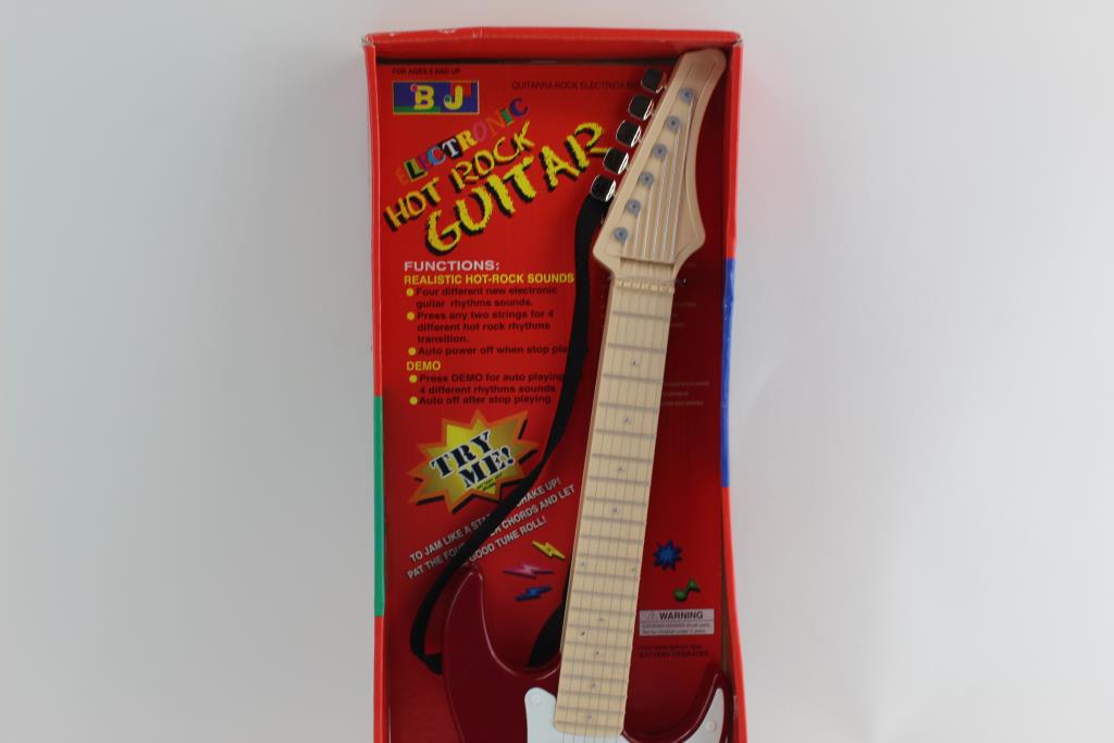 Electric Hot Rocks BJ Electric Hot Rock Toy Guitar | Property Room