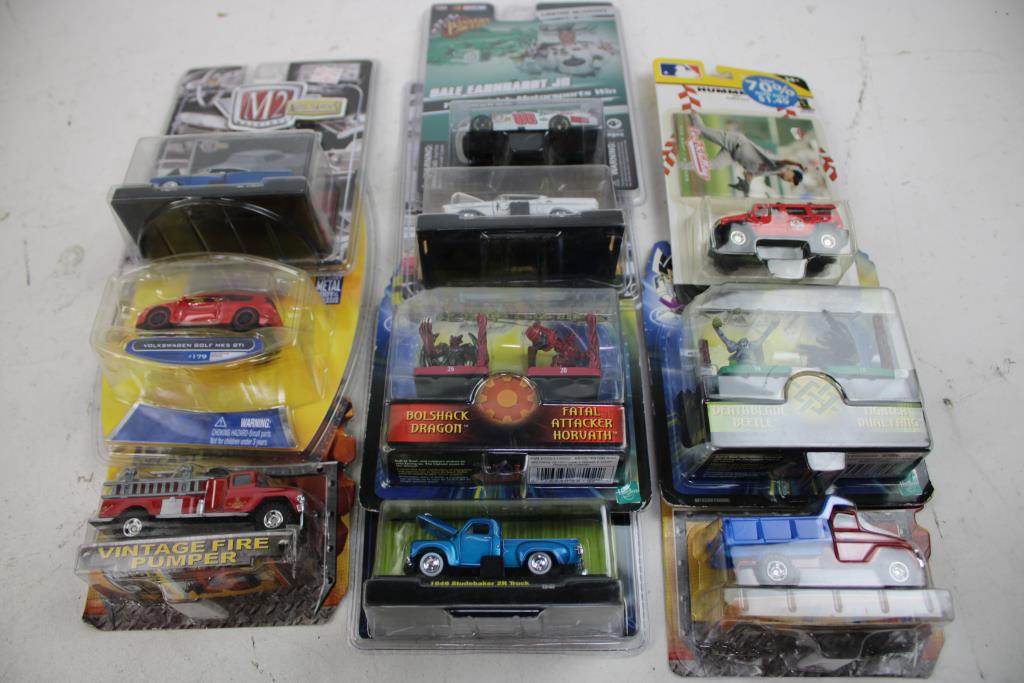 Die-Cast Cars, Bobbleheads, And Duel Masters Collectible Figures, 17 Pieces