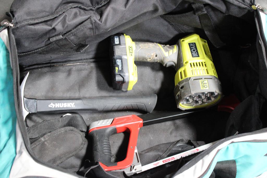 Makita Rolling Tool Bag With Ryobi Spotlight, Milwaukee Hack Saw, And Husky Hammer