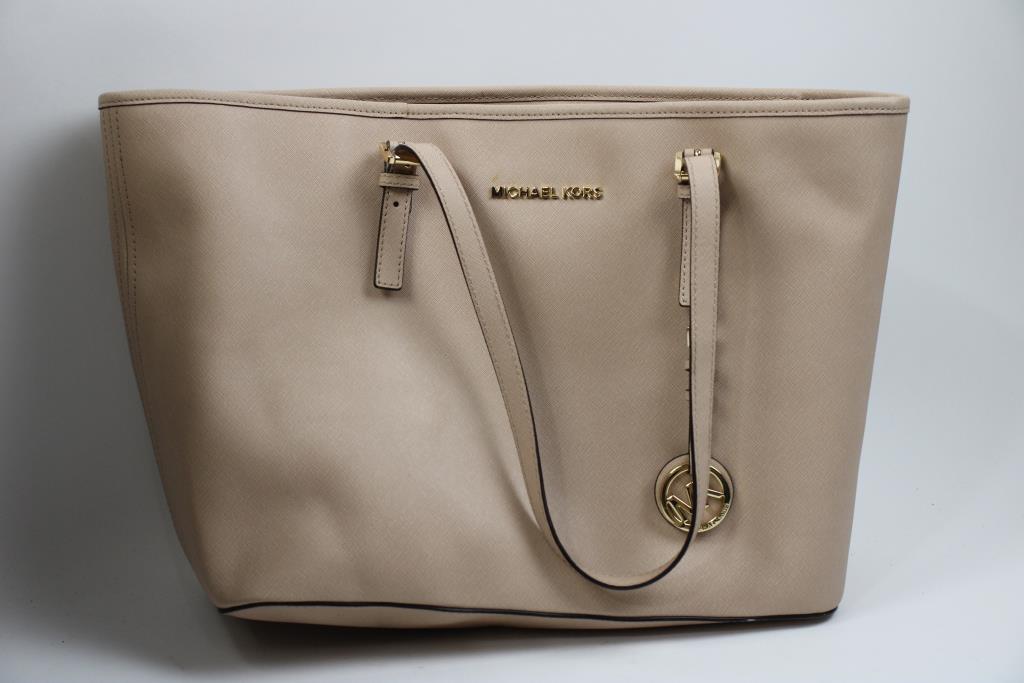 Michael Kors Pink Handbag With Black Michael Kors Wallet, And Coach Wallet