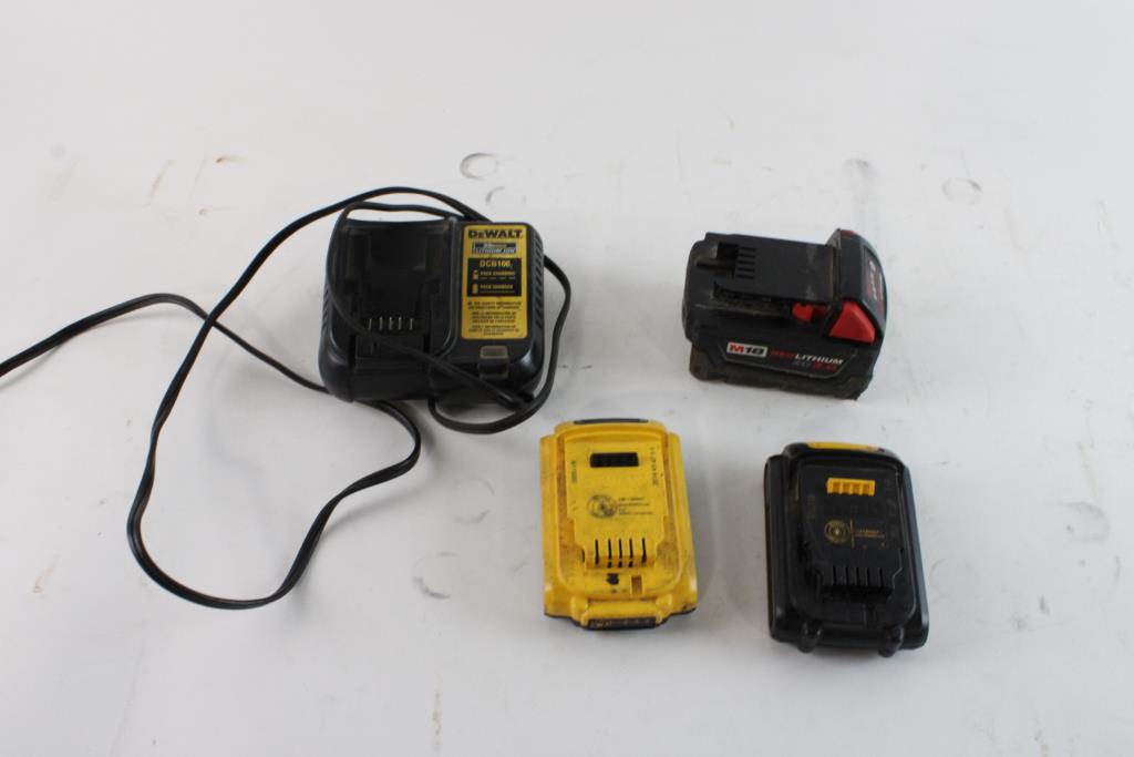 Milwaukee And DeWalt Batteries With DeWalt Charger, 4 Pieces Property