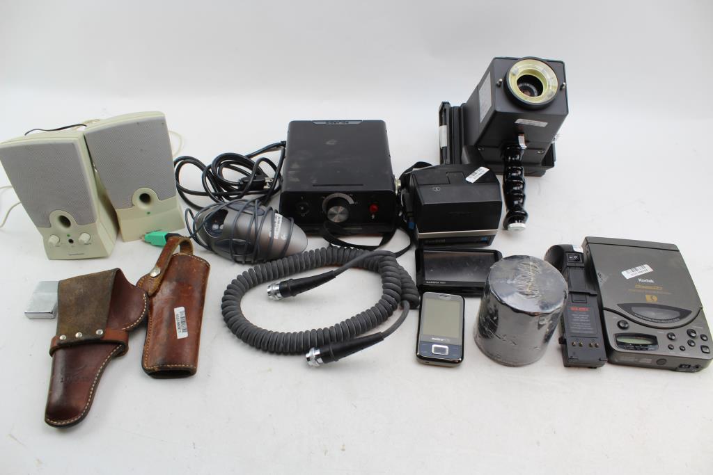 polaroid slide camera oil filter gun holster computer speakers