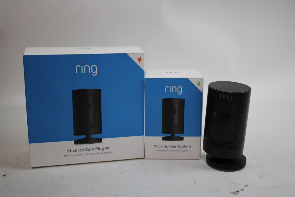 Ring Camera, Ring Stick Up Cam Plug-In, Cam Battery, And Wireless Earbuds, 4 Pieces