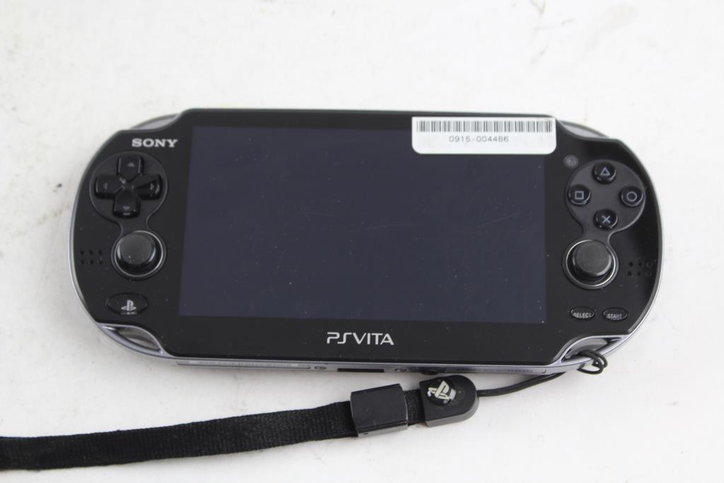 Sony PSVita Portable Gaming System And Ninja Gaiden Game 2 Items