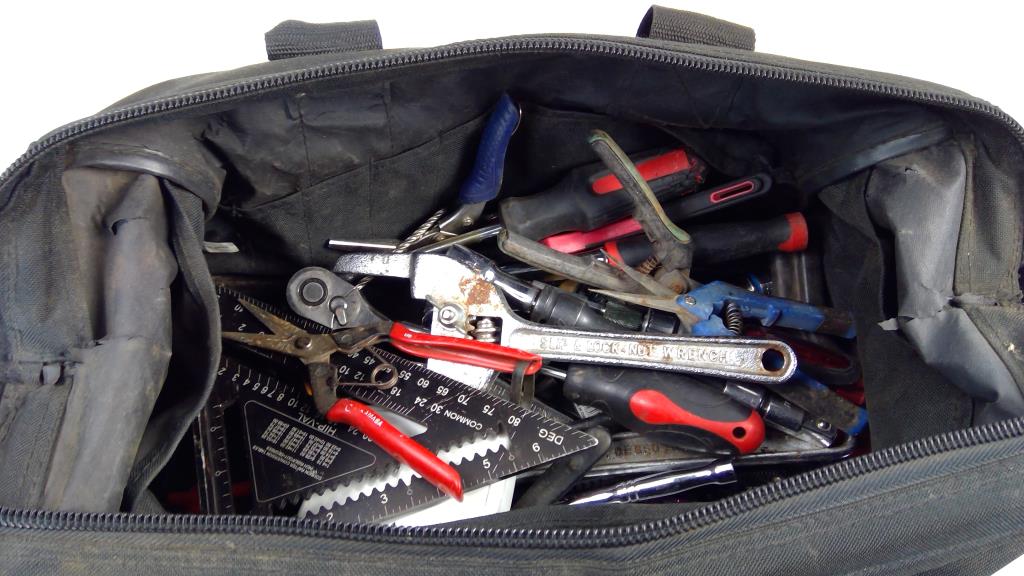 Tape Measure, Adjustable Wrench, And More In Black & Decker Tool Bag