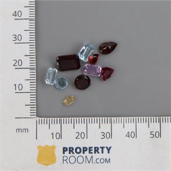 10 Loose Gemstones Including Amethyst, Garnet, Blue Topaz
