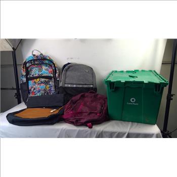 4 Backpacks In Green Container