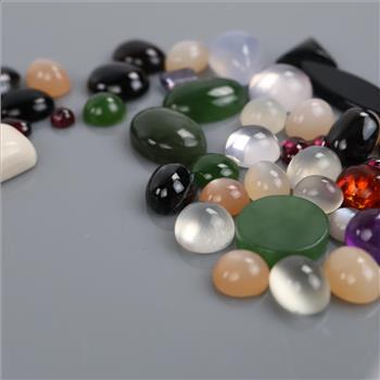 50+ Loose Gemstones Including Moonstone, Onyx, Garnet, Sodalite