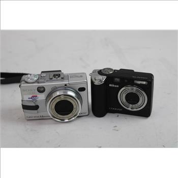 Audiovox VHS Player, Nikon Coolpix P50, Sony Cyber-Shot Digital Cameras, 3 Pieces