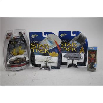 Die-Cast Cars, Bobbleheads, And Duel Masters Collectible Figures, 17 Pieces