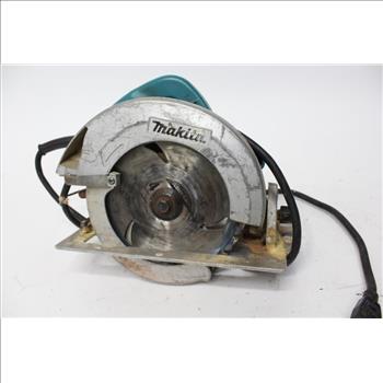 Makita And Skilsaw Circular Saws In A Green Costco Bag