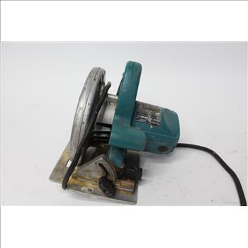 Makita And Skilsaw Circular Saws In A Green Costco Bag