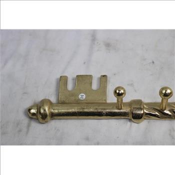 Metallic Art Piece Shaped Like A Key Coat Hanger