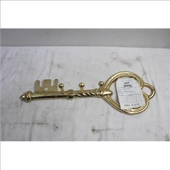 Metallic Art Piece Shaped Like A Key Coat Hanger