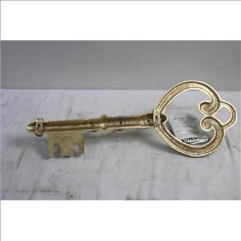 Metallic Art Piece Shaped Like A Key Coat Hanger