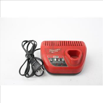 Milwaukee Battery Charger And Knockout Punch Set