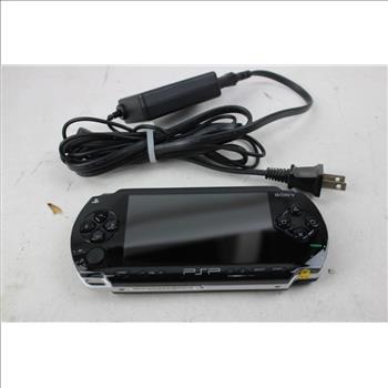 PSP With AC Adapter And The Warriors And Monster House Games