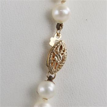 String Of Pearls With 14kt Gold Clasp And Diamond Accented Pendant