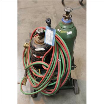Welding Torch With Hoses And Tanks On Cart
