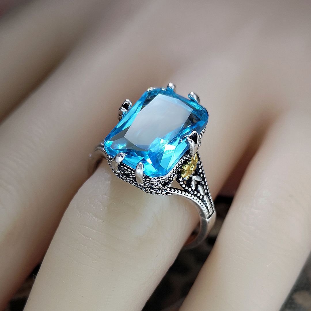 12.00ctw Blue Topaz 18k White Gold Overlay Ring
