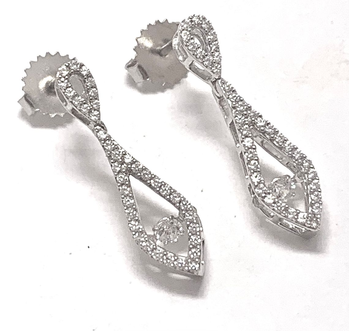 .925 Sterling Silver & 18k White Gold Dancing Diamond Design Earrings.