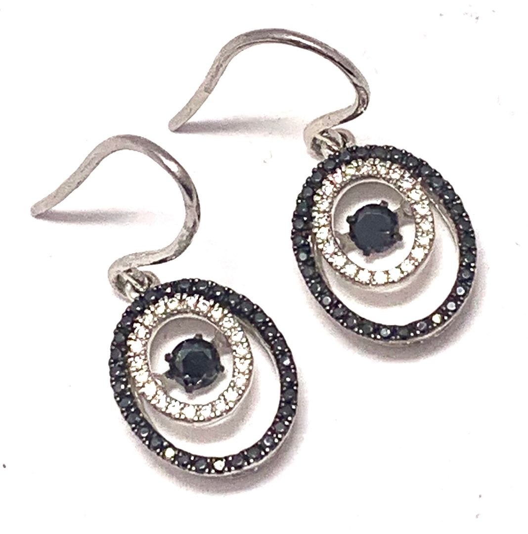 .925 Sterling Silver & 18k White Gold Dancing Diamond Design Earrings.