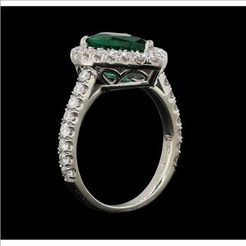 Platinum 7.60 Grams Diamond Halo Style Lady's Ring With Natural Emerald Center