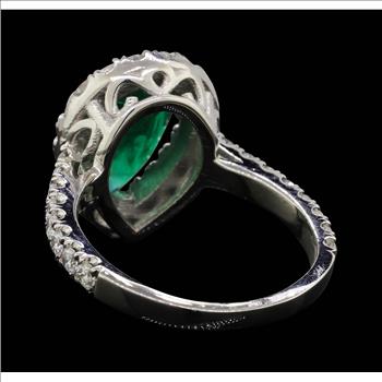 Platinum 7.60 Grams Diamond Halo Style Lady's Ring With Natural Emerald Center