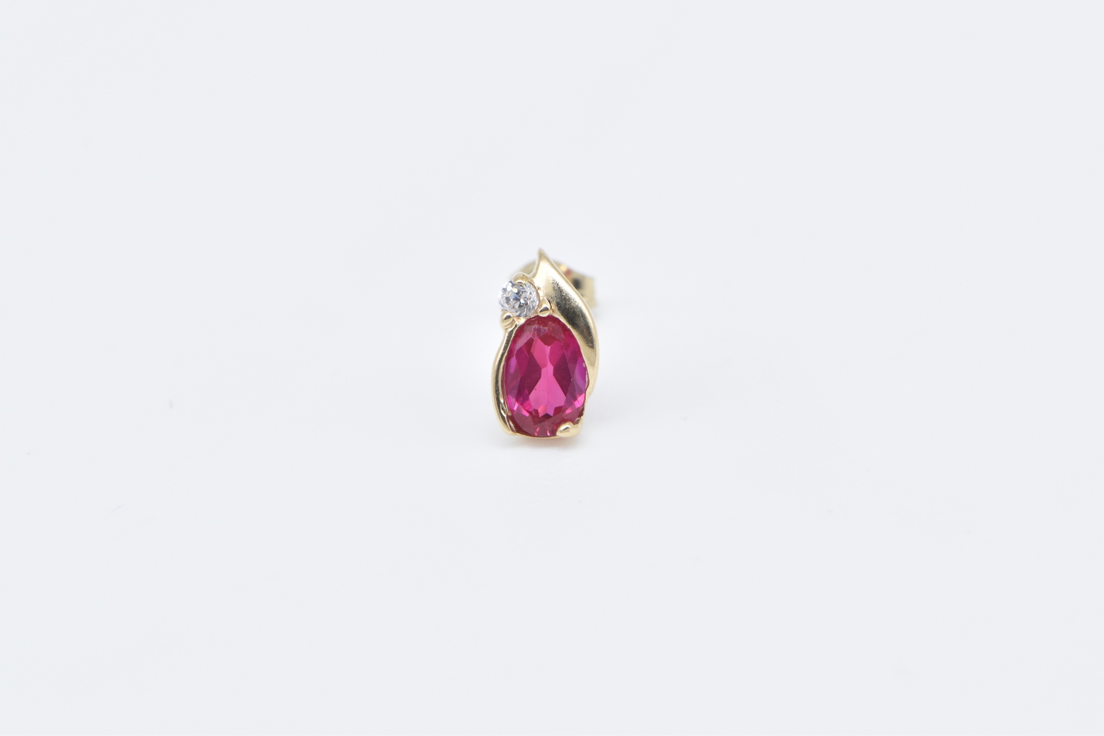 10K Oval Syn. Ruby Diamond Accent Single Stud Yellow Gold Earring