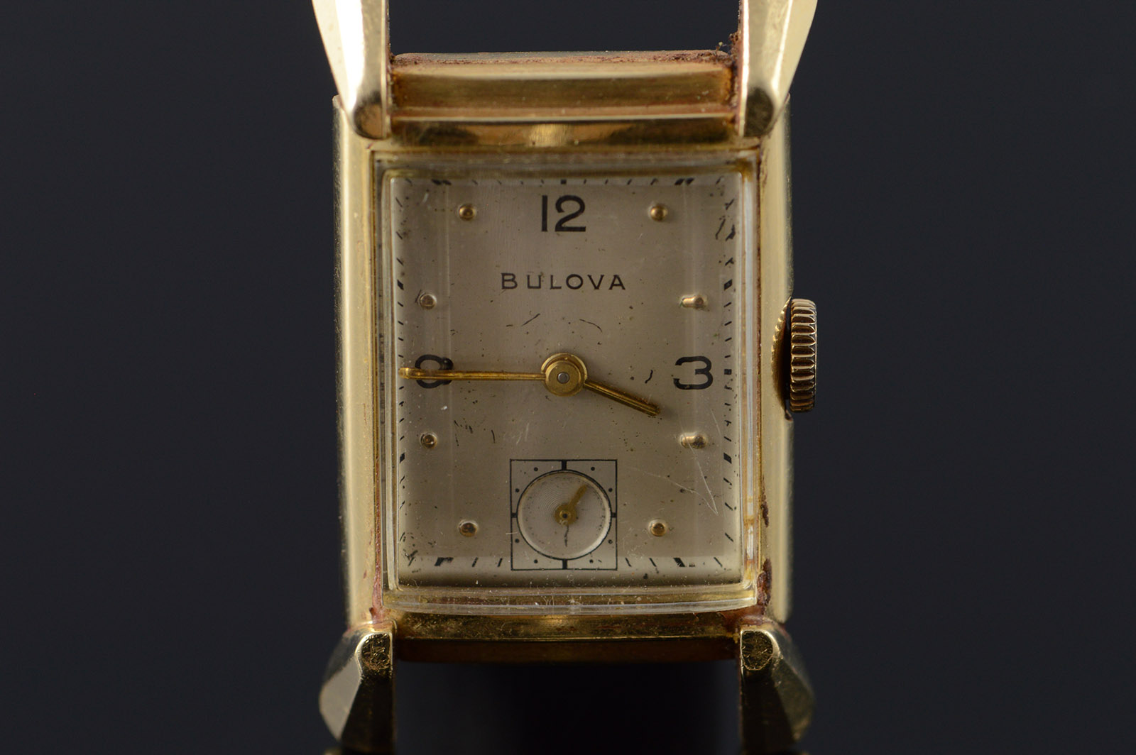 square gold bulova watch