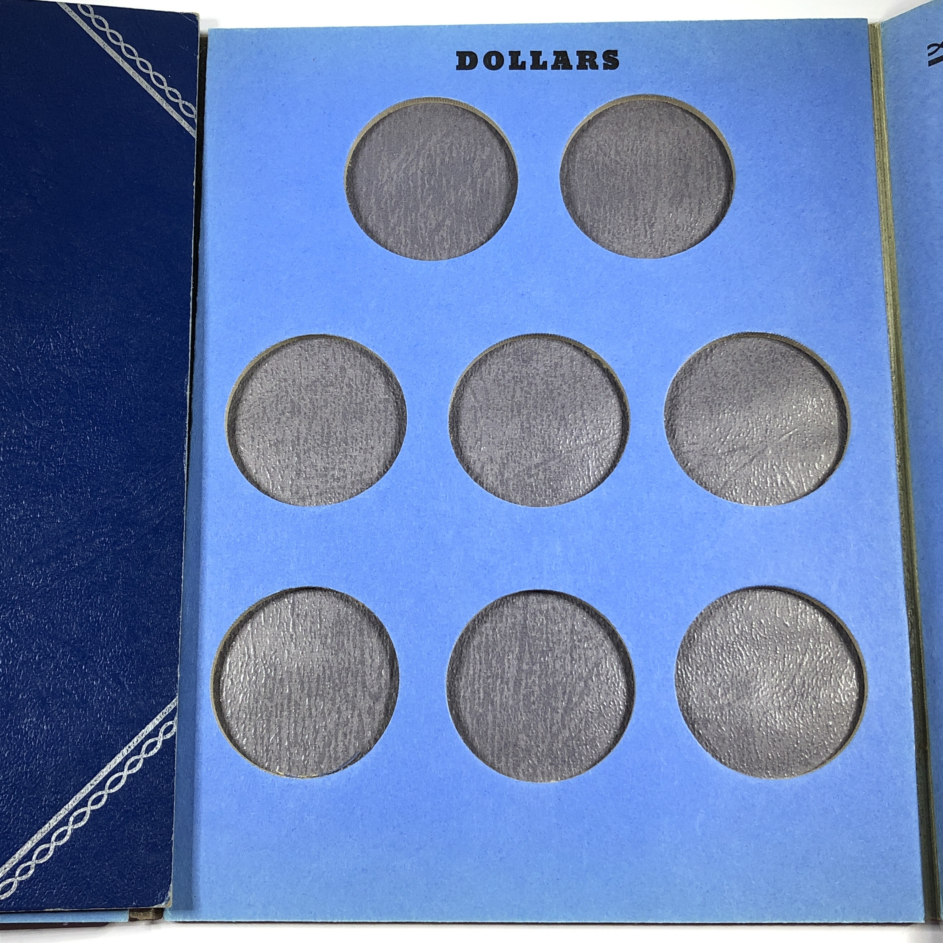 Preowned United States Silver Dollar Collector's Album*Includes 8