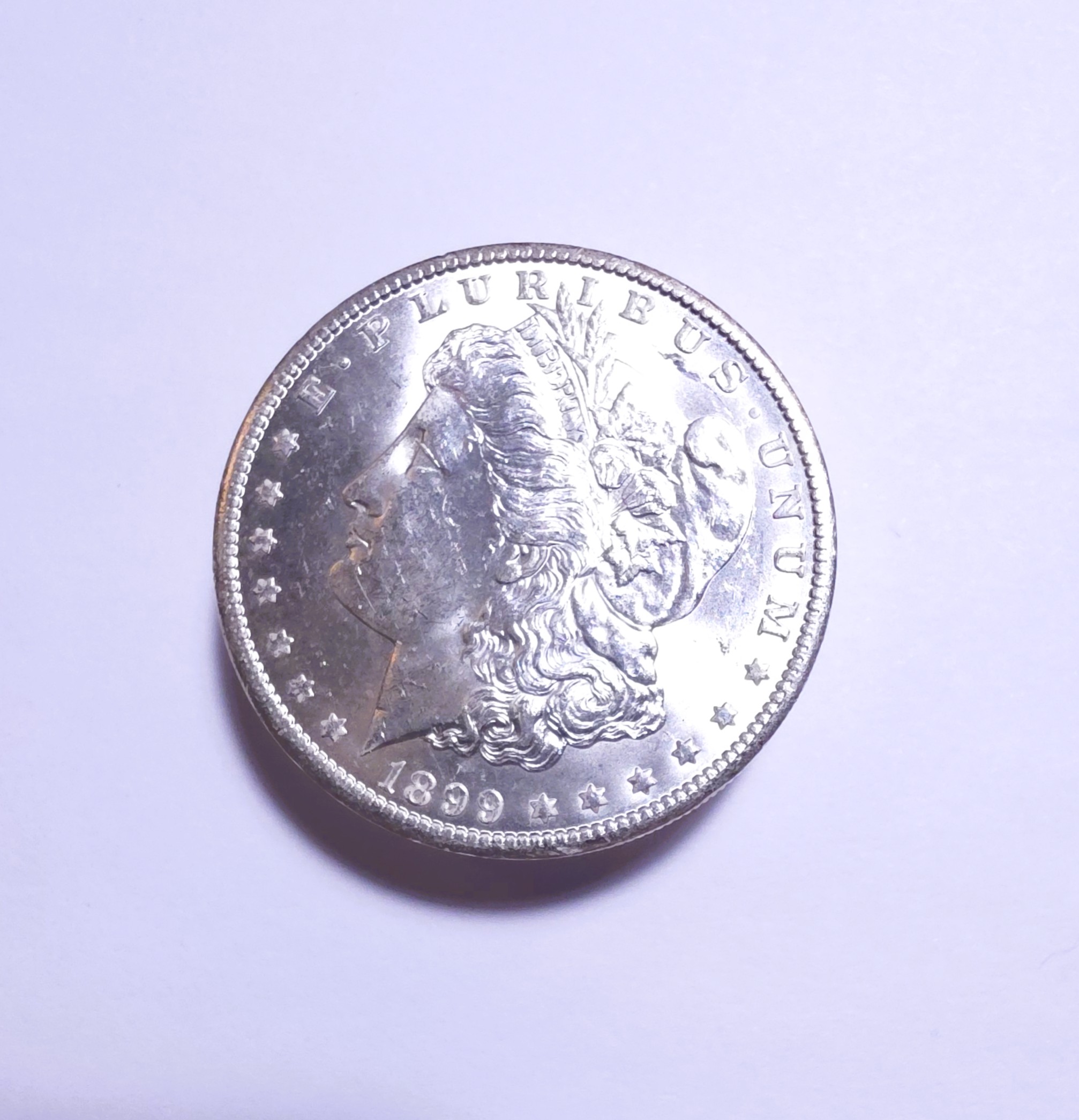 1899-O Morgan Silver Dollar - Select Brilliant Uncirculated - Die Breaks on Reverse - 102
