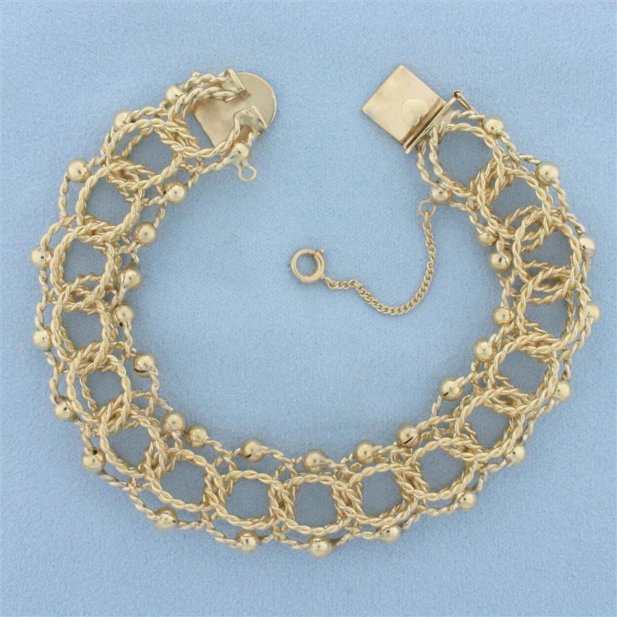 Wide Twisting Loop Rope Charm Bracelet in 14k Yellow Gold