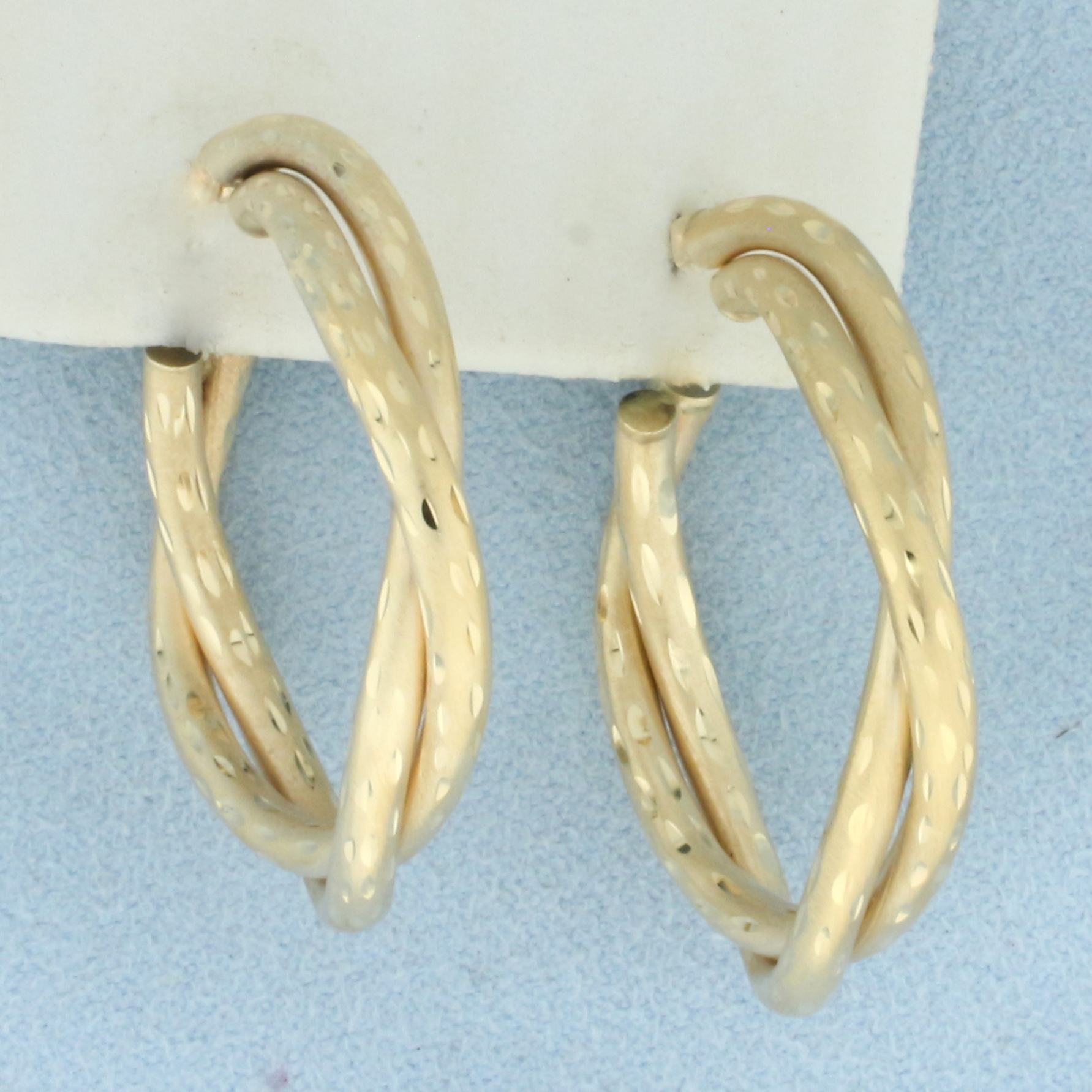 Diamond Cut Satin Finish Twisting Hoop Earrings in 14k Yellow Gold