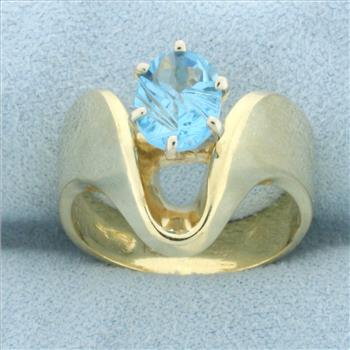 Fancy Oval Cut Swiss Blue Topaz Ring in 14k Yellow Gold