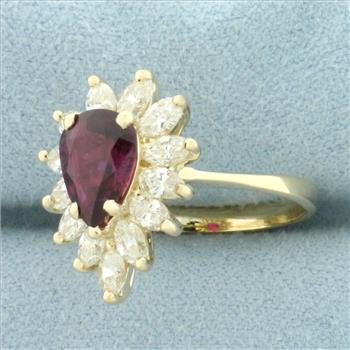 Pear Cut Ruby and Diamond Halo Ring in 14k Yellow Gold