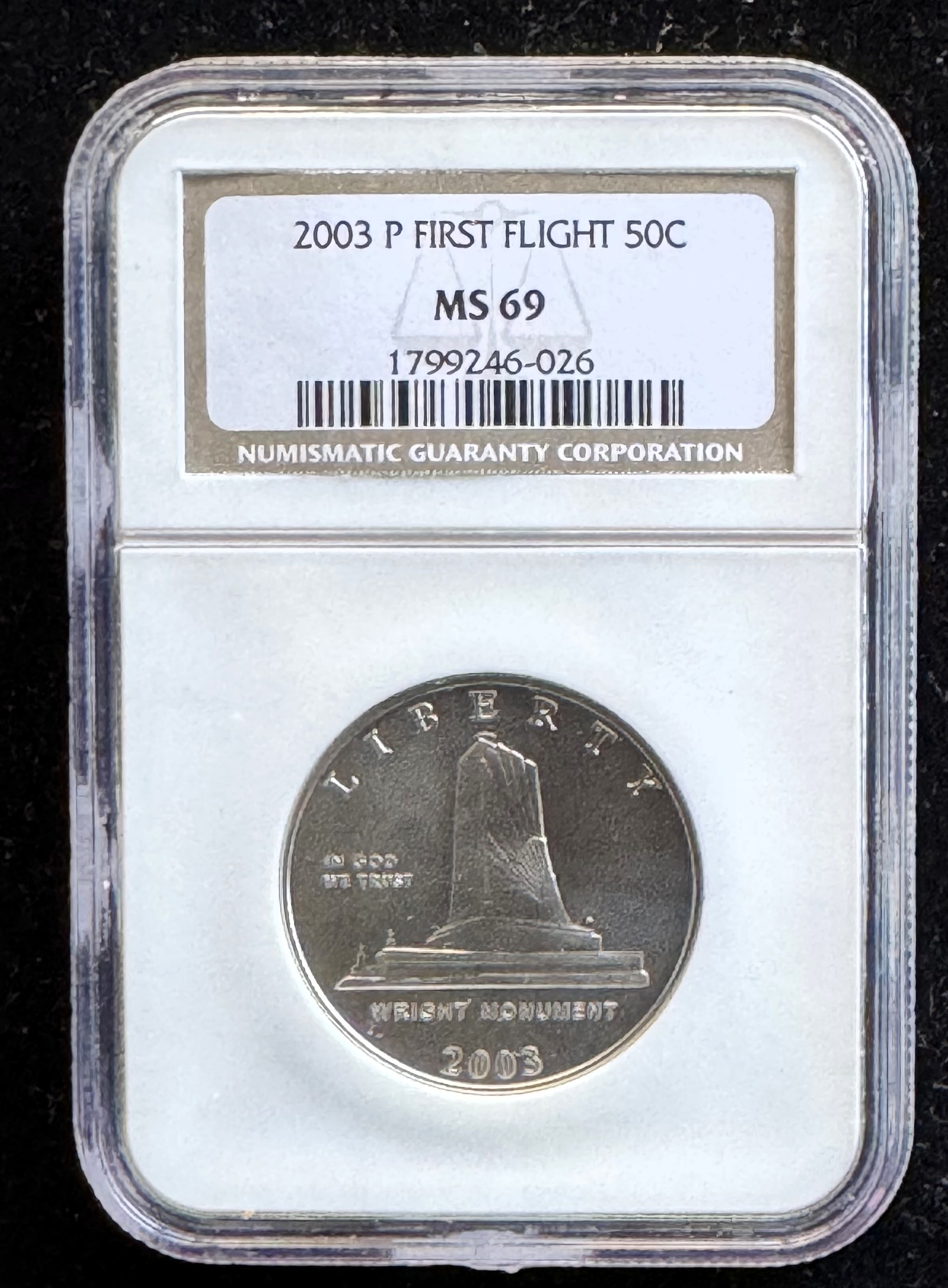 2003-P FIRST FLIGHT HALF DOLLAR, NGC GRADED MS-69 IN THE SLAB