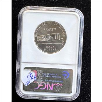 2003-P FIRST FLIGHT HALF DOLLAR, NGC GRADED MS-69 IN THE SLAB