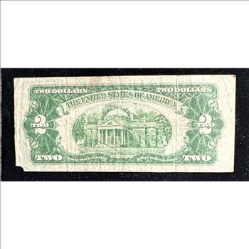 1928 D SERIES $2 DOLLAR UNITED STATES NOTE, RED SEAL, RED NUMBERS IN A SLEVE