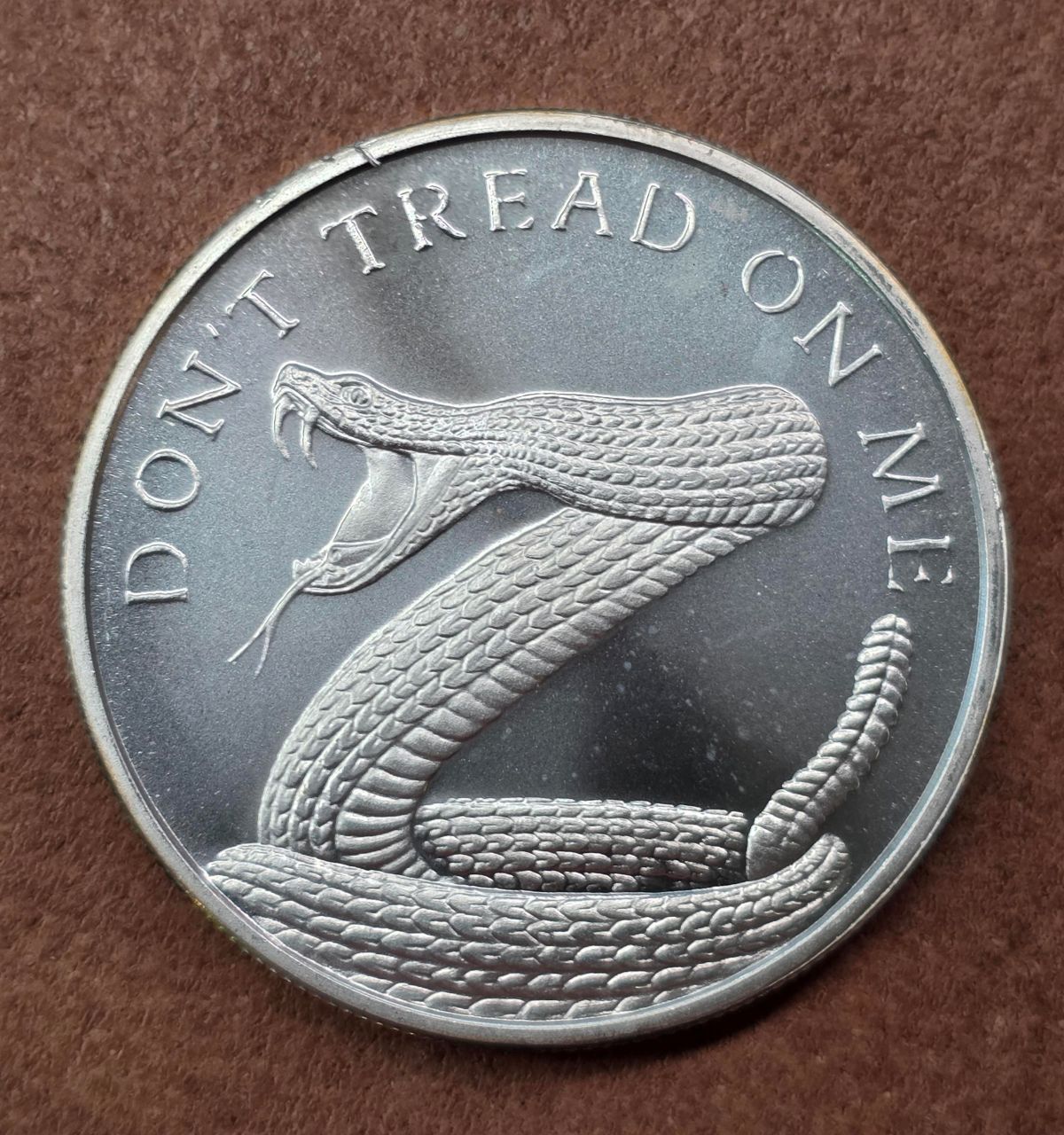 2023 1 oz Silver "Don't Tread On Me" Silver Shield Round - Abrasions